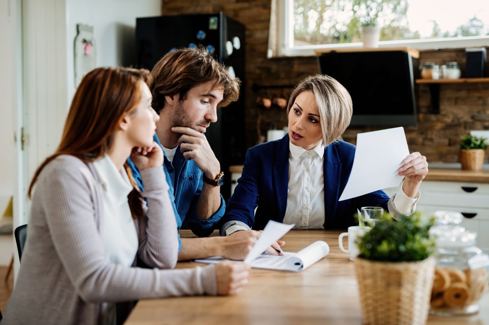 Financial advisor communicating with young couple