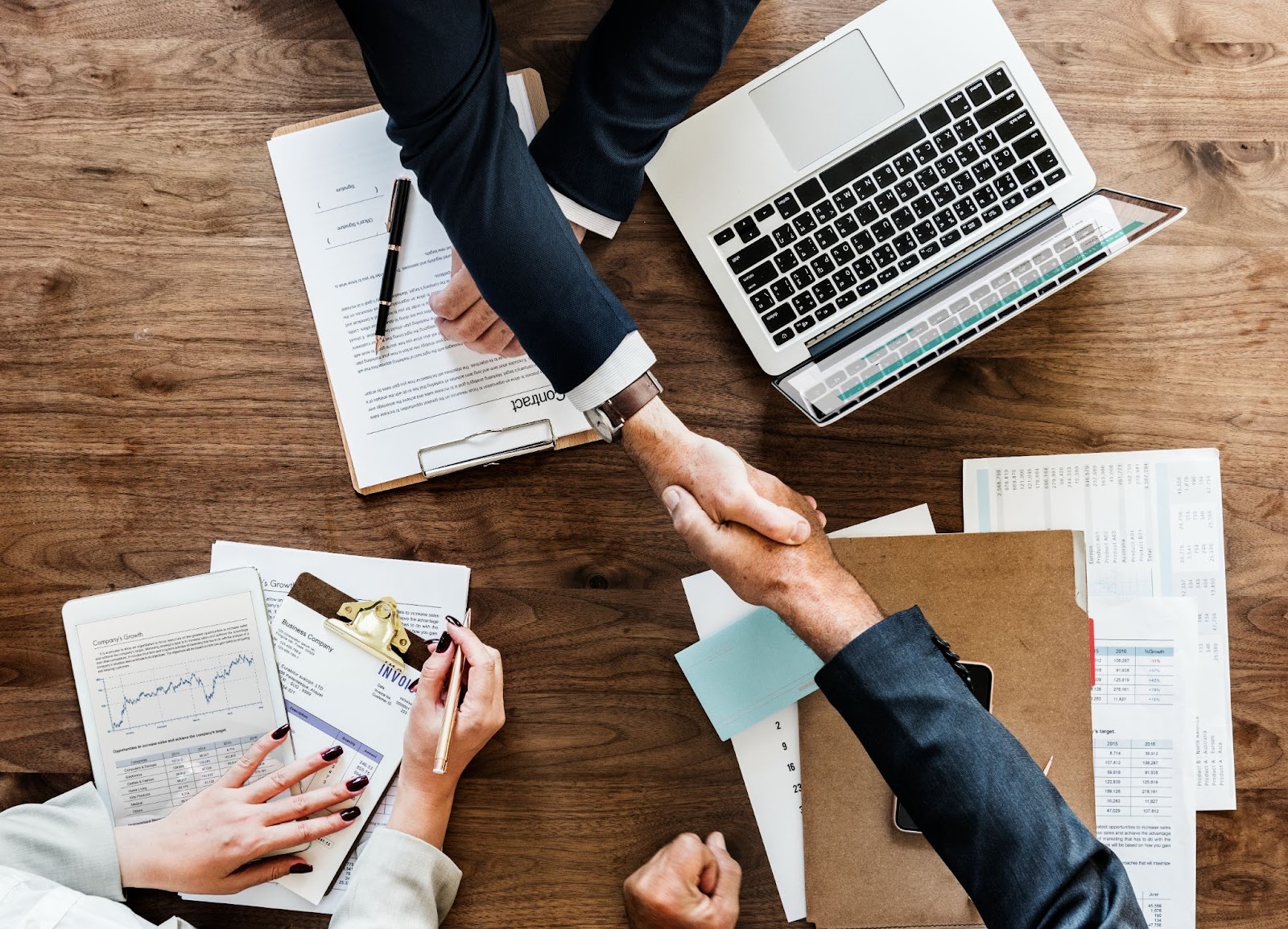 Top view of business people shaking hands together