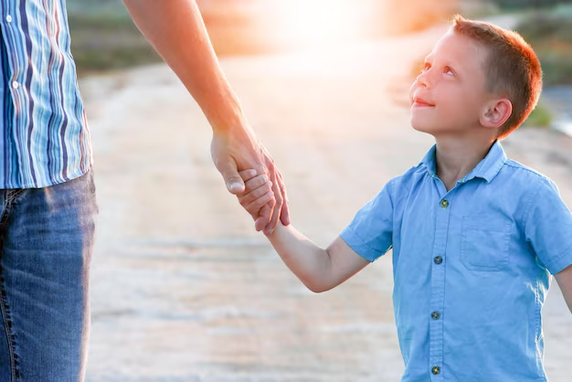 Child holding parent's hand